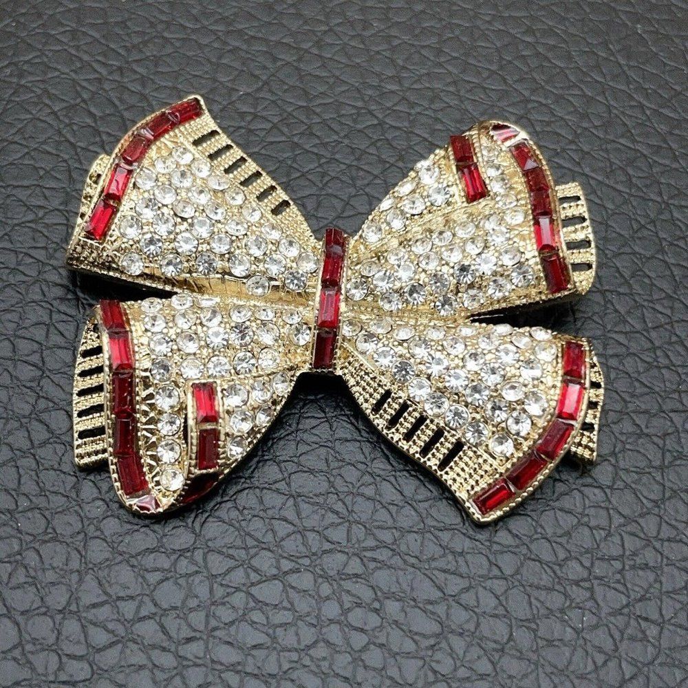Napier Bow Brooch Holiday Gold Tone Clear Round Rhinestones Red Baguettes 3D